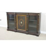 A Victorian ebonised Credenza with walnut crossbanding, the central door with oval jasperware