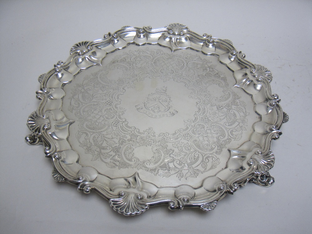 A Victorian silver shaped circular Salver with floral scroll engraving, coat of arms, scallop border - Image 2 of 2