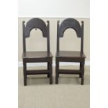 A pair of 17th Century oak Side Chairs with plain arched top rails, one with acorn finial, solid