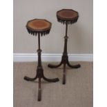 A pair 19th Century mahogany Candle Stands with octagonal tops above carved waterfall frieze on