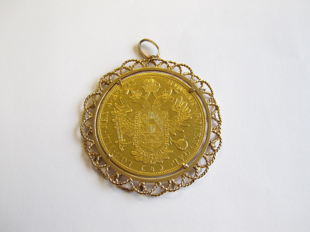 An Austrian 4 Ducat gold Coin in 18ct gold wirework pendant mount