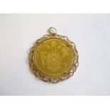 An Austrian 4 Ducat gold Coin in 18ct gold wirework pendant mount