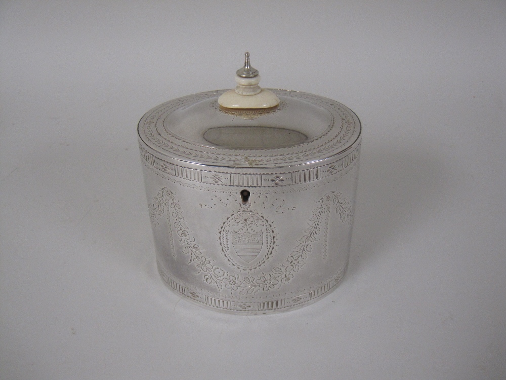 A George III silver oval Tea Caddy engraved floral swags, oval cartouche, London 1784, maker: Jos