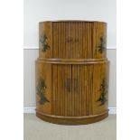 A 20th Century walnut Cocktail Cabinet of semi-circular two tier form with two pairs of tambour