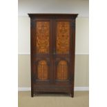 A Shapland & Petter Arts & Crafts Hall Cupboard with pair of marquetry inlaid panelled doors