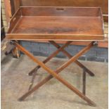 A 19th Century mahogany Butlers Tray on Stand, the rectangular tray with a drop front and pierced