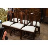 A Set of six late Georgian mahogany Dining Chairs with shaped top rails, pierced splats, white