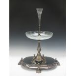 A Victorian plated Epergne with platform base having bevelled mirror and cherub supports, baluster