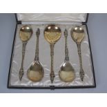 Four Victorian silver-gilt apostle handled Serving Spoons with spiral stems, London 1887/8 and a