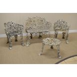 A white painted cast iron small Settee with fruiting vine design, 2ft 10in, a pair of simular Chairs