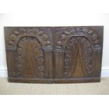 A pair of 17th Century oak Doors from a cabinet dated 1620