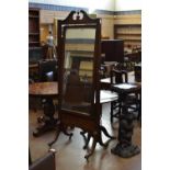 A 19th Century mahogany framed Robing Mirror having swan neck surmount with floral swag and