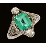 An early 20th Century Emerald and Diamond Ring claw-set step-cut emerald, estimated 2cts, between