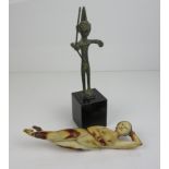 A Chinese carved ivory 'Doctors Model' reclining with hand held behind head, 9 1/4 in L (damaged),