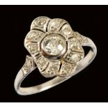 An early 20th Century Diamond Cluster Ring, the openwork lozenge shaped plaque millegrain-set old-