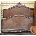 A 19th Century rosewood Louis XV style Bed, the panelled headboard with a carved shell and foliage