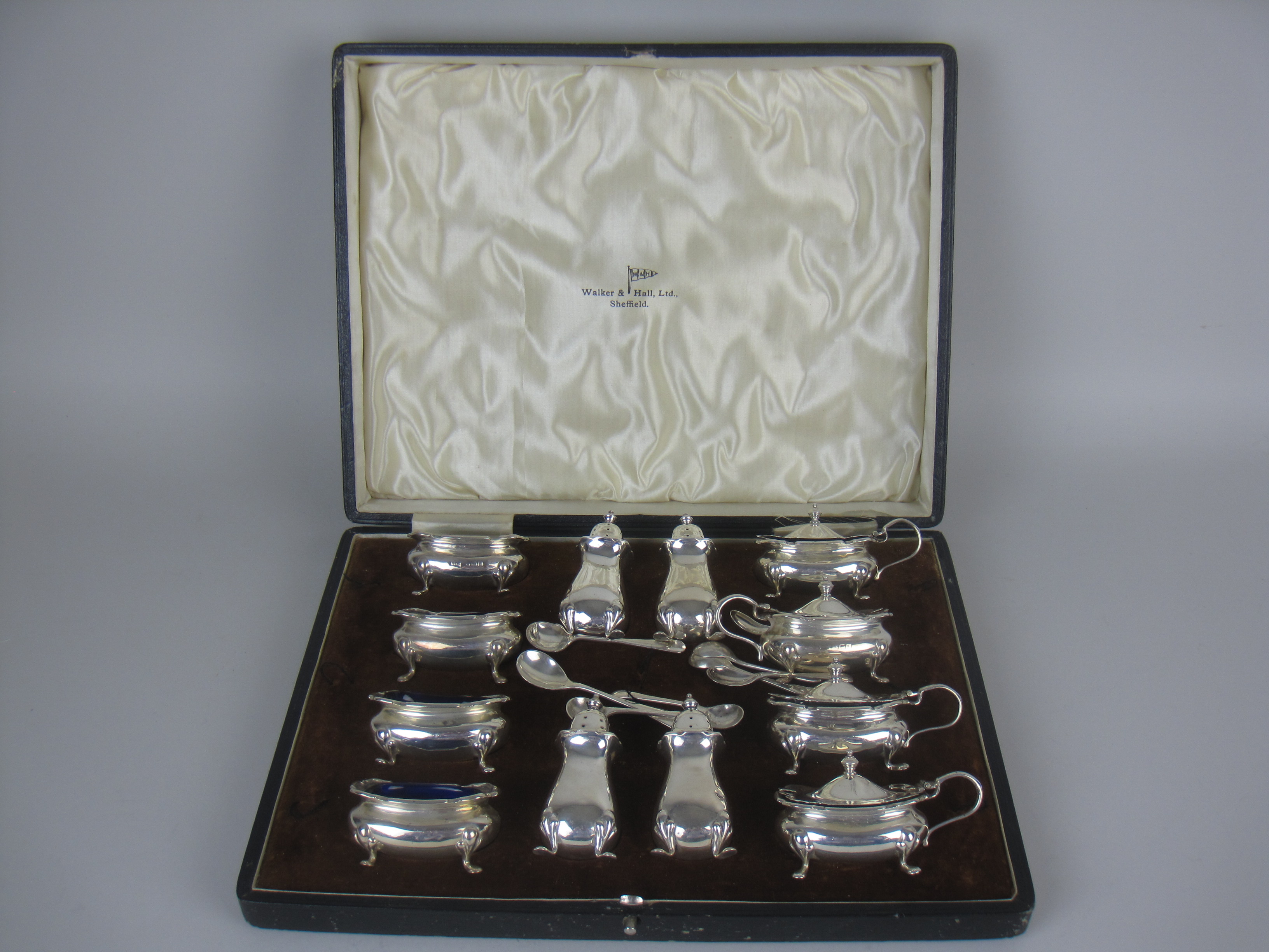 A George V silver twelve piece Condiment Set, Birmingham 1928/9, maker: Walker & Hall, cased, plus - Image 3 of 3