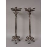 A pair of plated Table Candelabra on corinthian columns and three paw feet with scallop