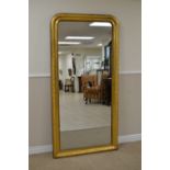 A 19th Century gilt framed Mirror with floral and leafage shallow carving surrounding headed frieze,