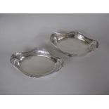 A pair of George V silver pierced oval Dishes on scroll feet, Sheffield 1924/25, 11 x 7in, maker: