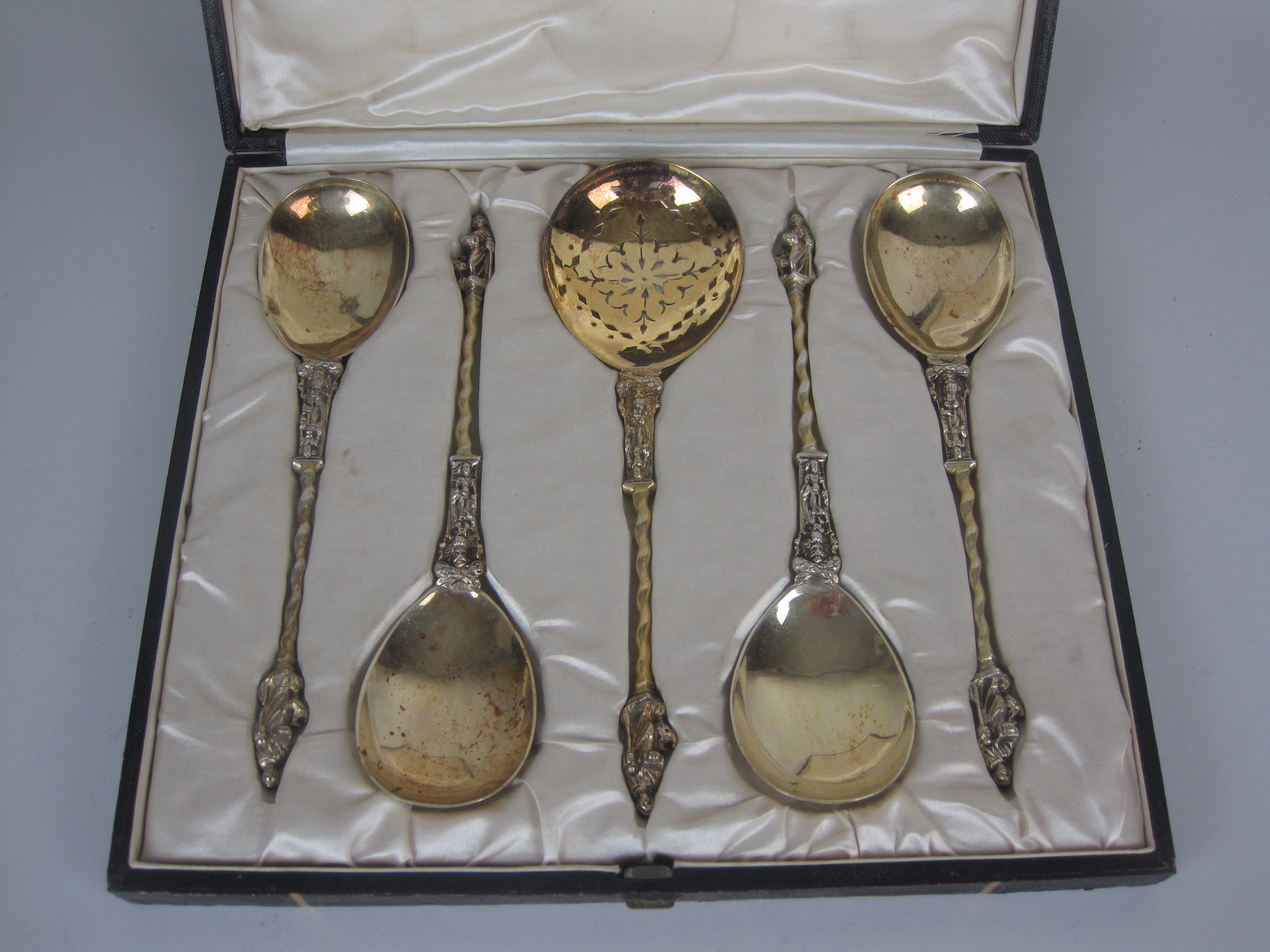 Four Victorian silver-gilt apostle handled Serving Spoons with spiral stems, London 1887/8 and a - Image 2 of 3