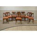 A set of eight 19th Century Continental elm Dining Chairs with panelled top railos with brass