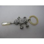 An Edward VII silver Rattle with four applied bells and mother of pearl teether, Birmingham 1902