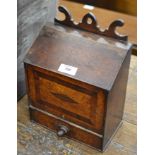 A 19th Century inlaid oak Salt Box, the shaped back and sloping lid above a drop front base drawer 9