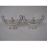 A pair of George III Sheffield plated two handled oval Sauce Tureens, engraved crests, beaded