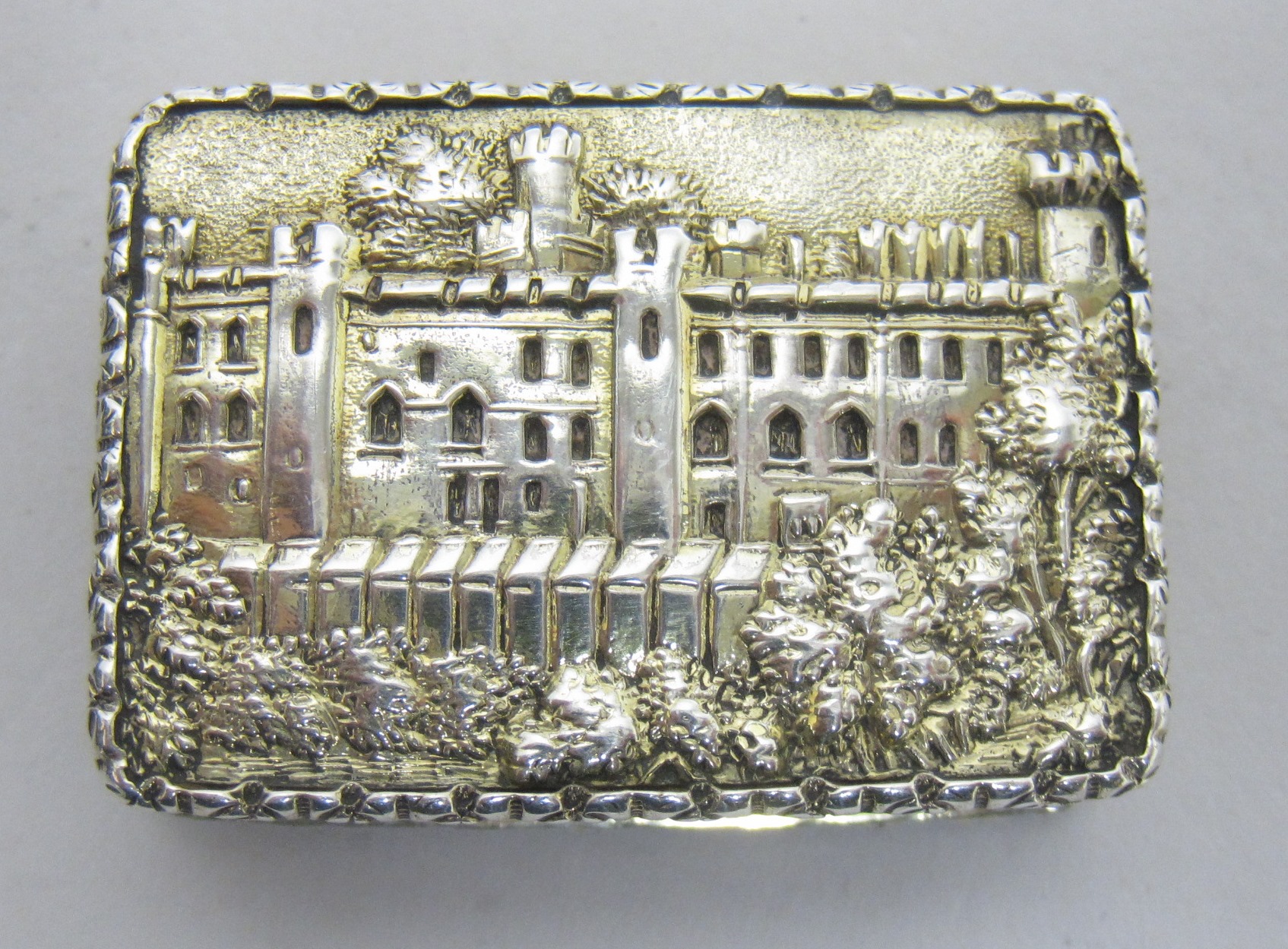 A Victorian silver castle top Vinaigrette, the lid depicting Warwick Castle in fine detail, the