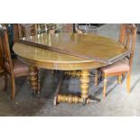 A Victorian oak Howard & Son extending oval Dining Table on turned tapering supports and casters,