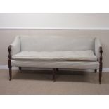 A 19th Century mahogany and upholstered Settee with shaped arms on six turned supports and