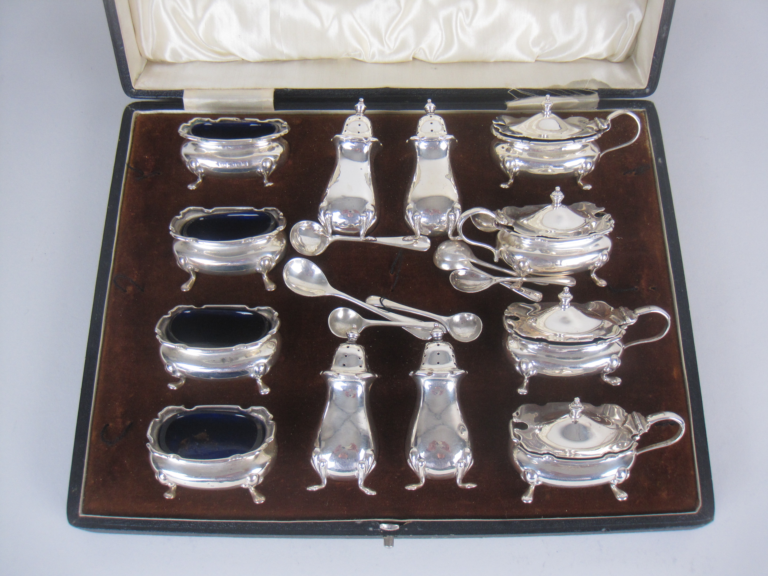 A George V silver twelve piece Condiment Set, Birmingham 1928/9, maker: Walker & Hall, cased, plus - Image 2 of 3