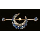 A Sapphire and Diamond Brooch having crescent pavé-set old-cut diamonds and graduated cushion-cut