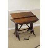 A Regency Architect's Table with brass inlaid adjustable top above shallow frieze drawer on cheval