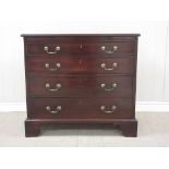 A George III Bachelor's Chest in mahogany fitted brushing slide above four long graduated drawers on