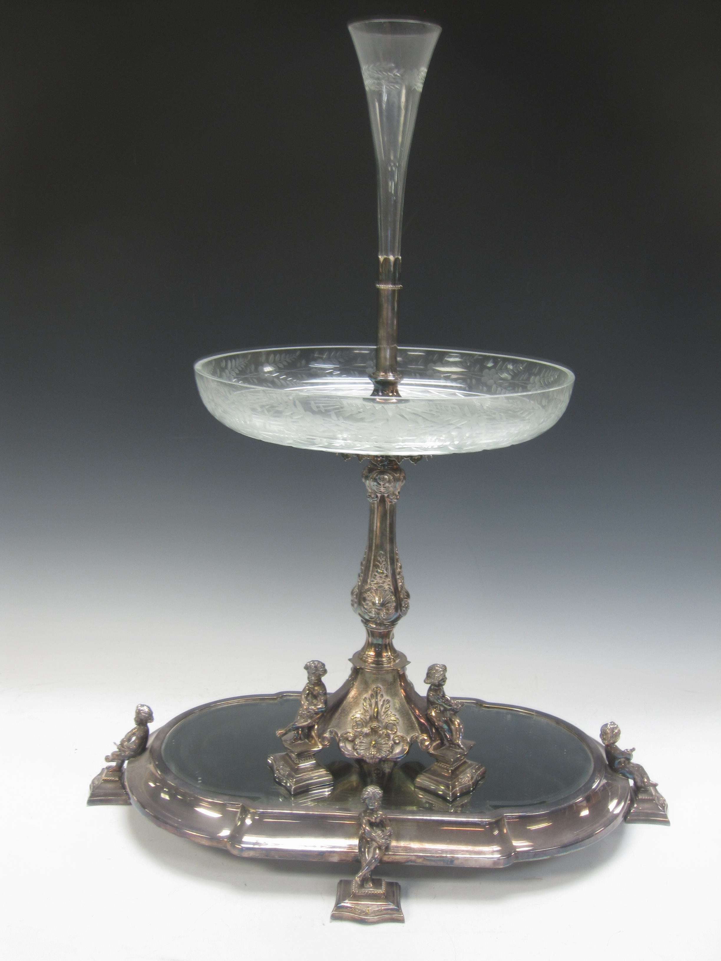 A Victorian plated Epergne with platform base having bevelled mirror and cherub supports, baluster - Image 3 of 3