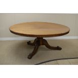 A 19th Century large Irish mahogany Breakfast Table with circular top on bulbous turned column,