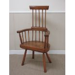 ‡An ash and chestnut comb back Elbow Chair in the 18th Century style with thick plank seat upon four