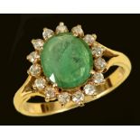 An Emerald and Diamond Cluster Ring claw-set oval-cut emerald within frame of fifteen brilliant-