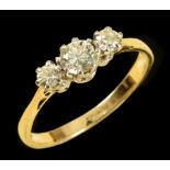 A Diamond three stone Ring claw-set graduated old-cut stones, stamped 18ct, ring size M 1/2