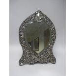 A Victorian silver framed Easel Mirror with bevelled heart shape plate having cherub and floral