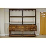 A 19th Century oak Dresser and open Rack, the base fitted six drawers above pot cupboard base