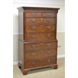 A George III mahogany Chest on Chest with carved frieze fitted two short and six long drawers