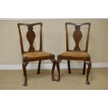 A Set of six Queen Anne style oak Dining Chairs with solid seats, rush drop-in seats on cabriole