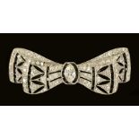 An Art Deco style Diamond and Onyx Bow Brooch the openwork plaque millegrain-set principle