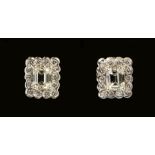 A pair of Diamond Cluster Earrings each claw-set step-cut stone, approx 0.50cts, within