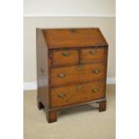 An early 18th Century small oak Bureau with interior drawers and pigeon holes over two short and two