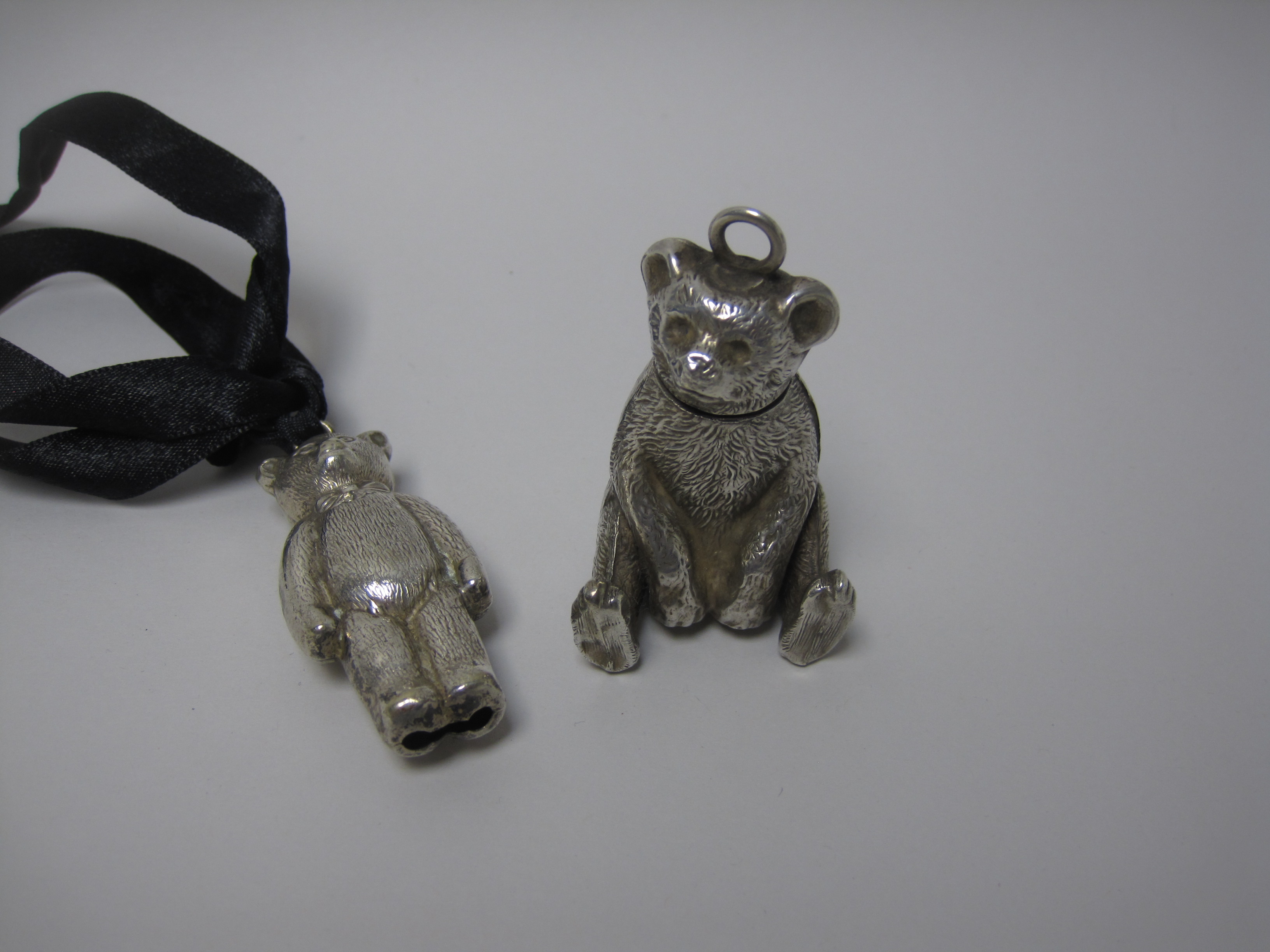 An Edward VII silver Teddy Bear Pill Box, Birmingham 1909 and a plated Teddy Bear Rattle - Image 2 of 4