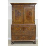 A William and Mary walnut Cabinet, the upper section with ovolo long drawer above pair of feather